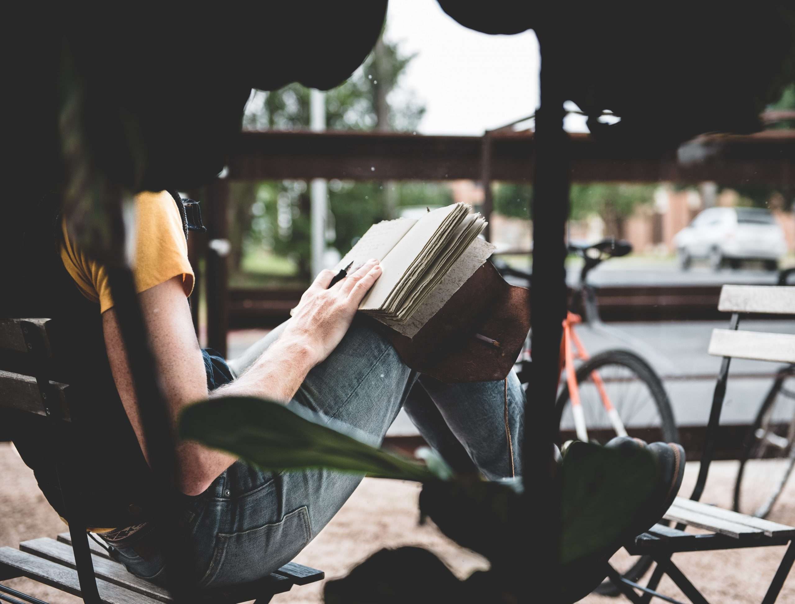 woman-sitting-with-journal-in-hands