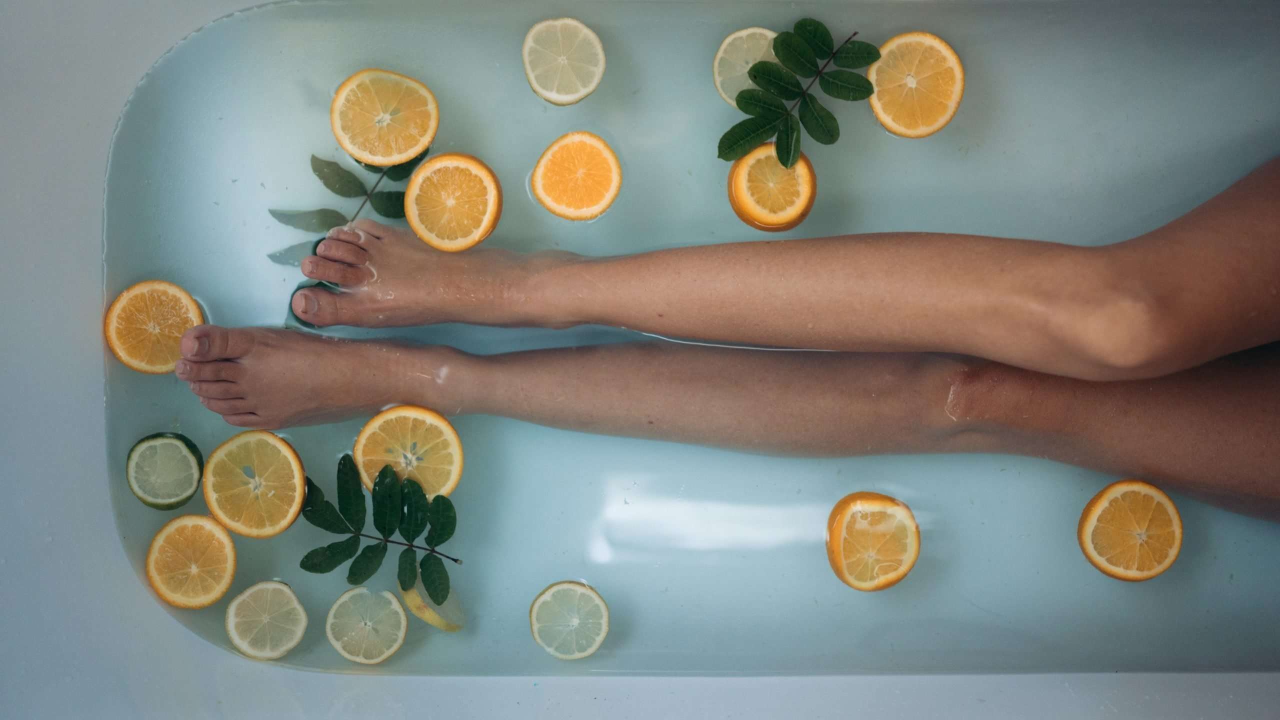 legs-in-bath-with-orange-slices
