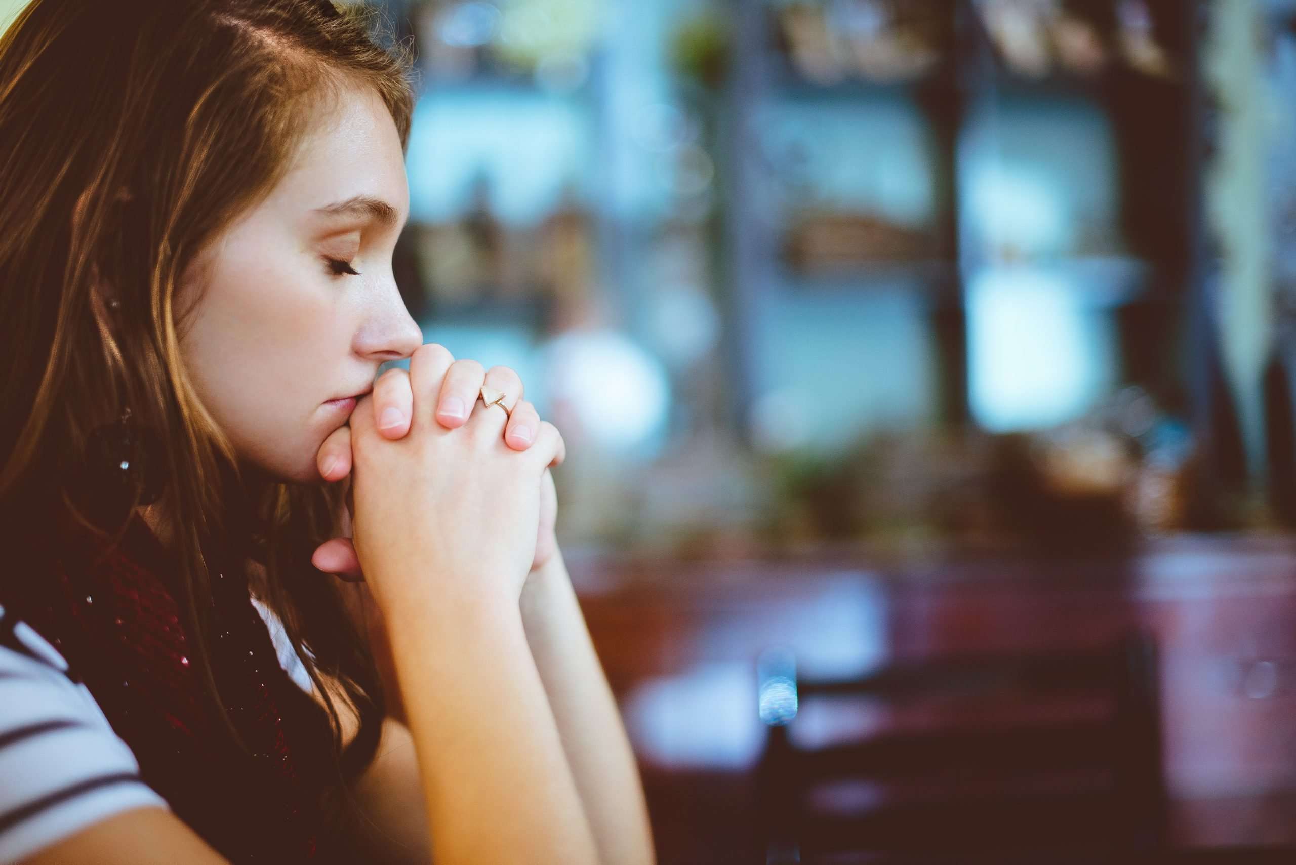 woman-holding-hands-in-prayer