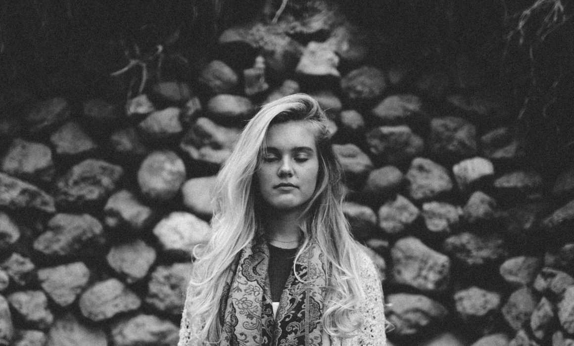 black-and-white-of-woman-with-eyes-closed