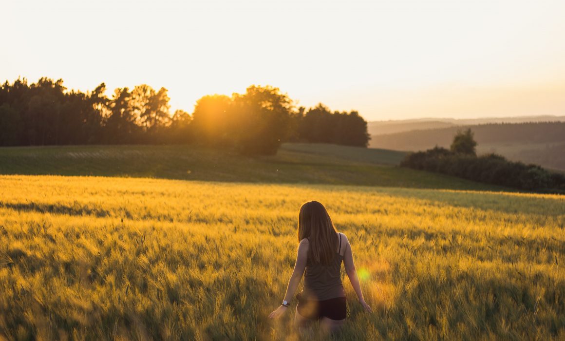 walking-in-field-at-sunset