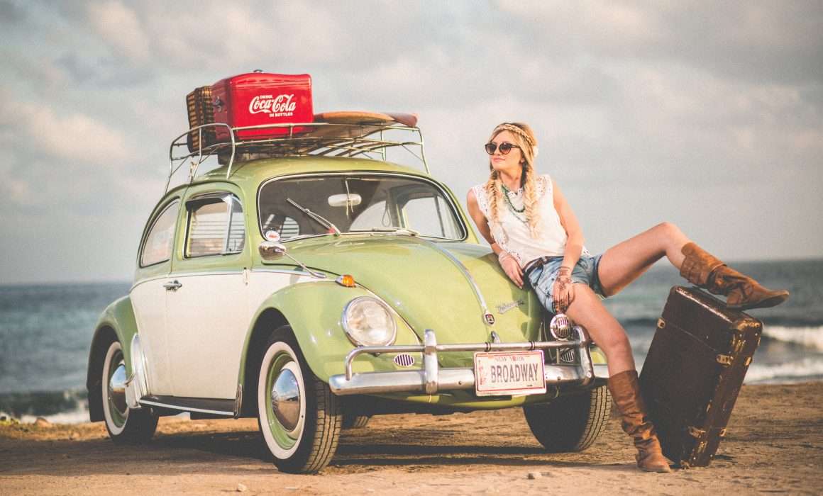 travel-and-personal-growth-woman-by-mini-car