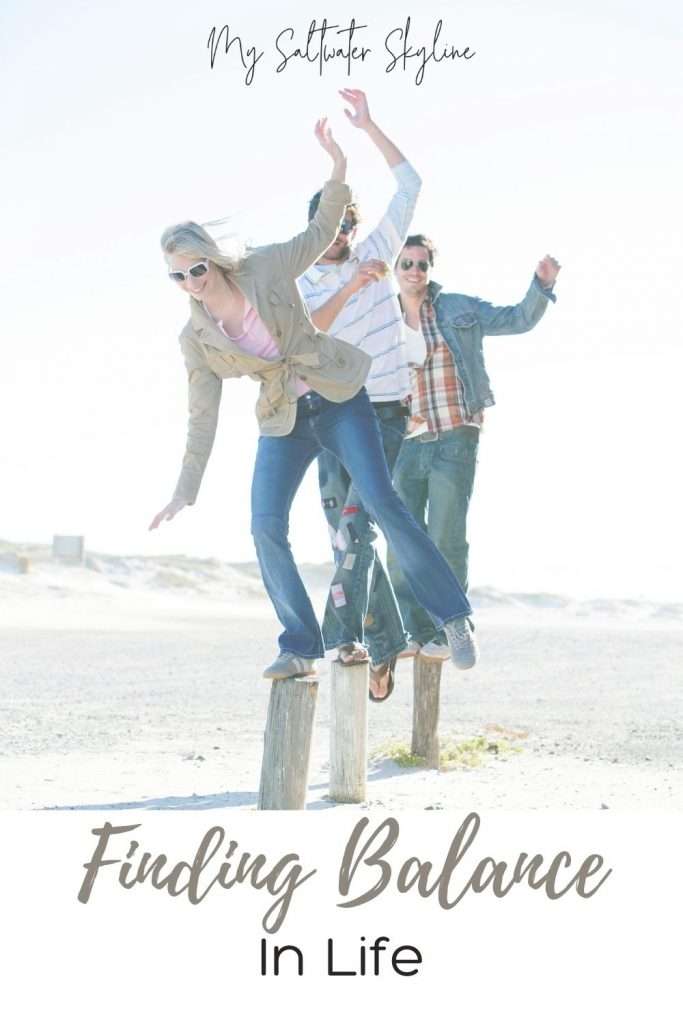 friends-balancing-on-poles-finding-balance