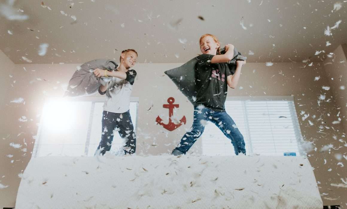 kids-jumping-on-bed-having-pillow-fight-setting-boundaries-blog