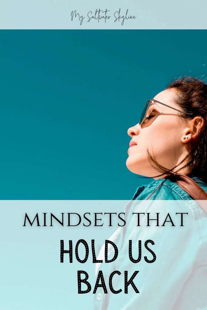woman-looking-up-at-blue-sky-mindsets-that-hold-us-back-blog-post