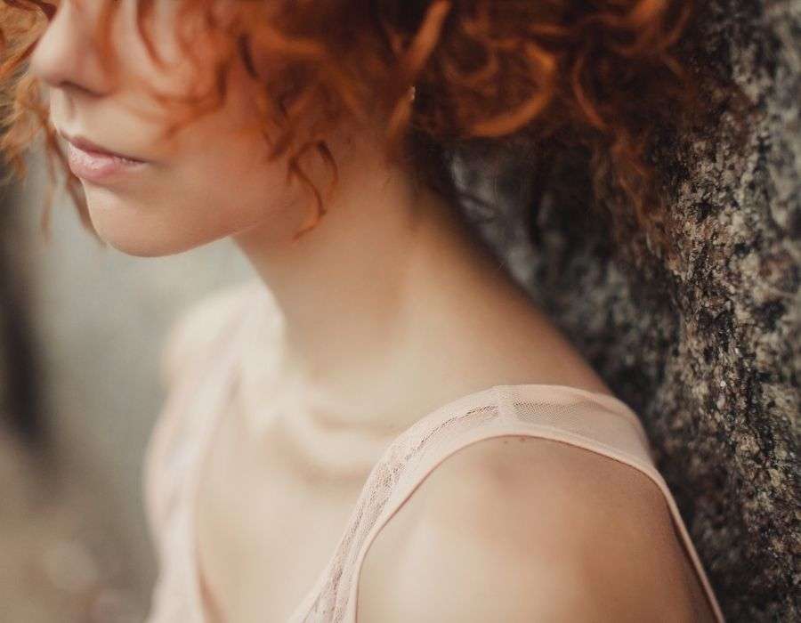 close-up-bottom-half-of-womans-face-sad-expression-curly-red-hair-forgiving-yourself-blog-post