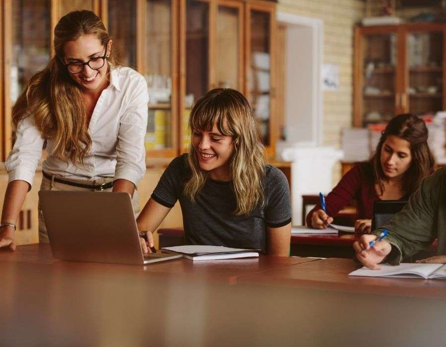 giving-back-through-service-woman-helping-student