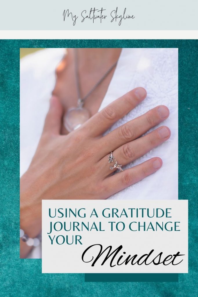 close-up-hand-on-heart-white-shirt-crystal-bracelet-gratitude-journal-blog-post-pin