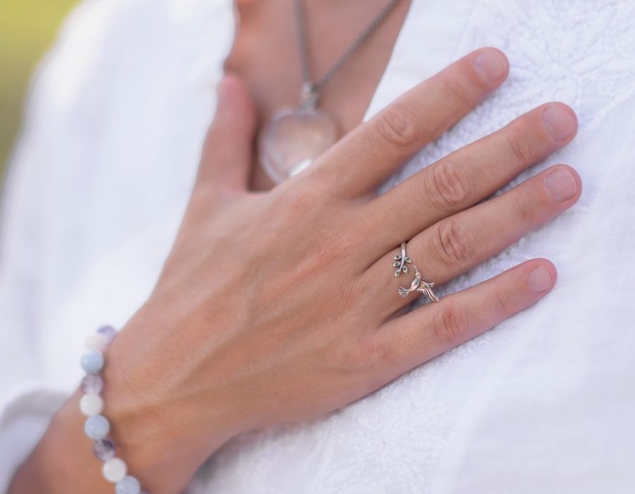 close-up-hand-on-heart-white-shirt-crystal-bracelet-gratitude-blog-post