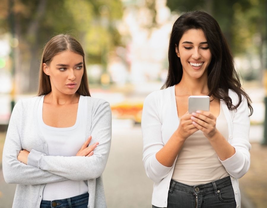 girl-looking-jealously-at-friend