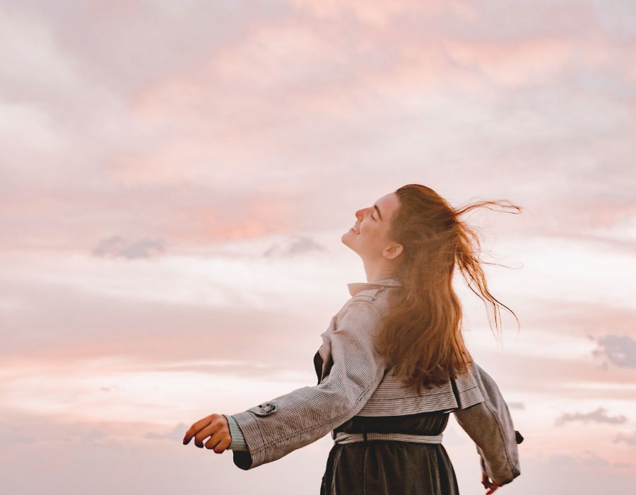 woman-long-hair-face-to-the-sky-feeling-life's-abundance