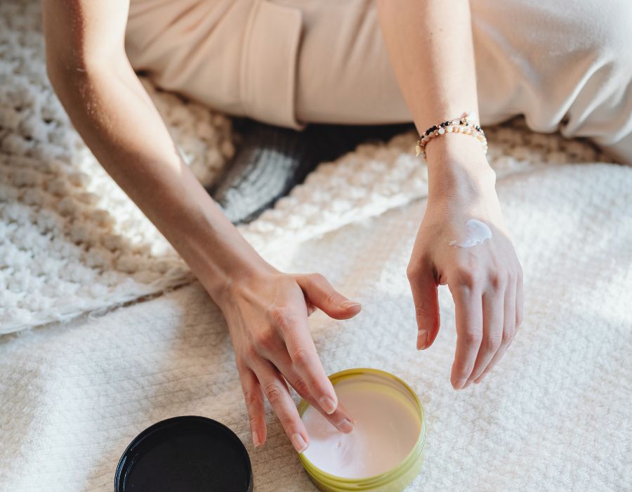 from-above-hands-reaching-into-tub-of-cream-self-care-sunday-blog