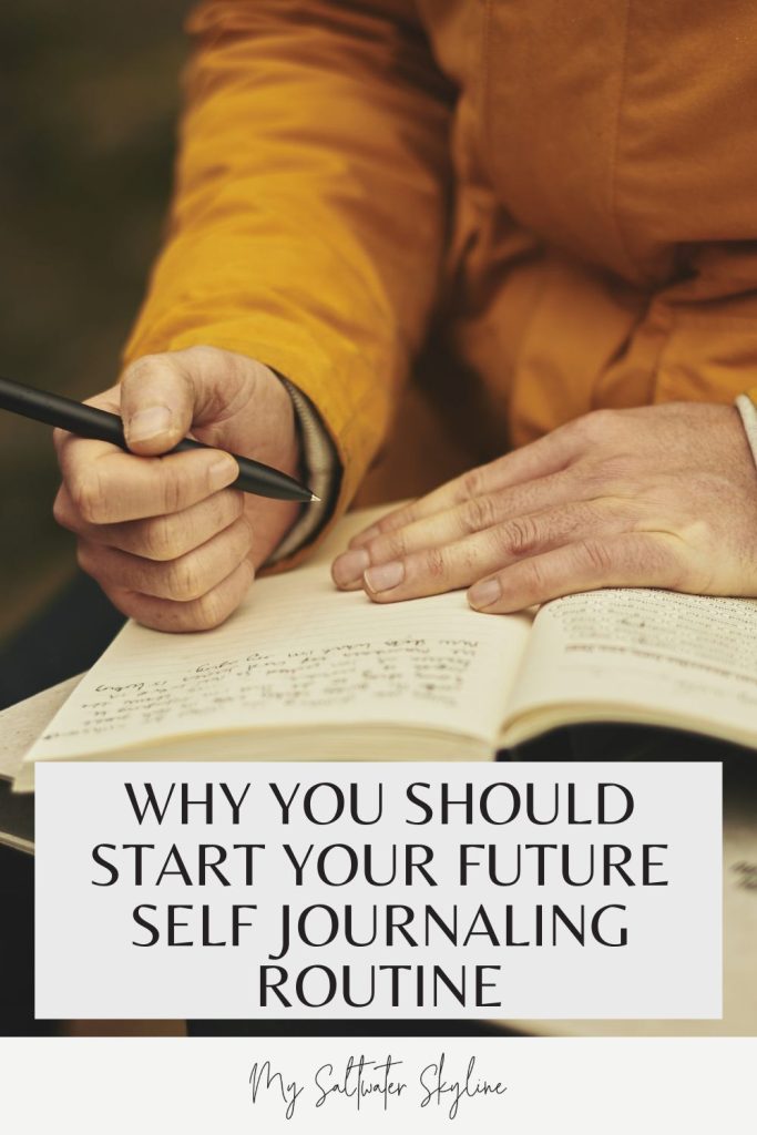 pin-close-up-writing-in-journal-mustard-jumper-book-on-lap-future-self-journalinng-blog