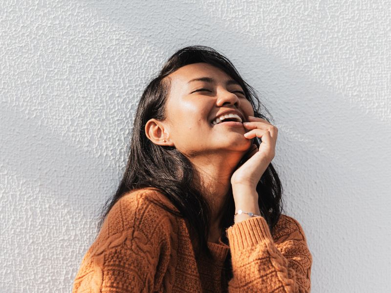woman-smiling-face-to-the-sky-show-up-for-yourself-blog
