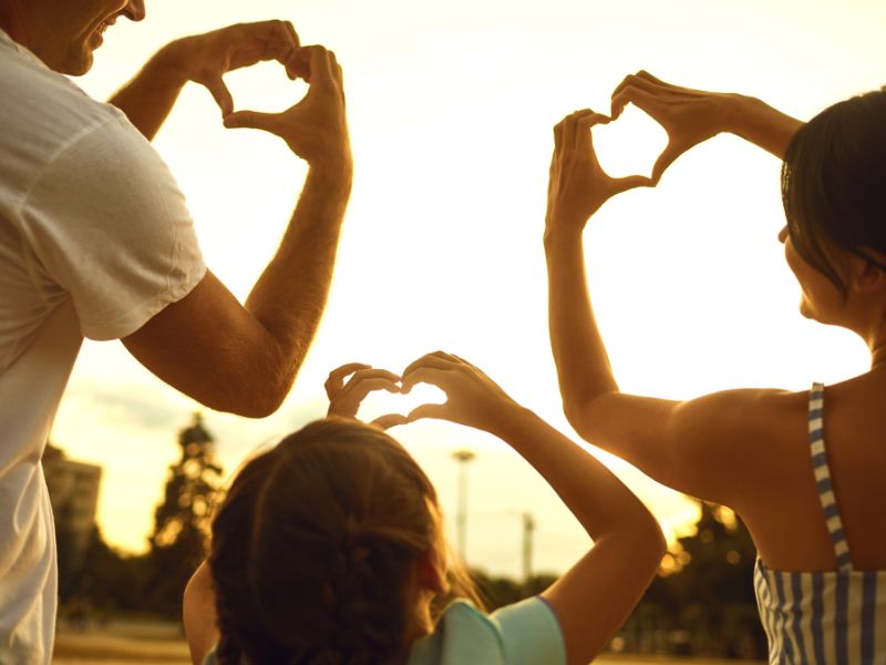 silhouette-family-hands-shaped-into-hearts-against-sky-tomorrow-never-comes-blog