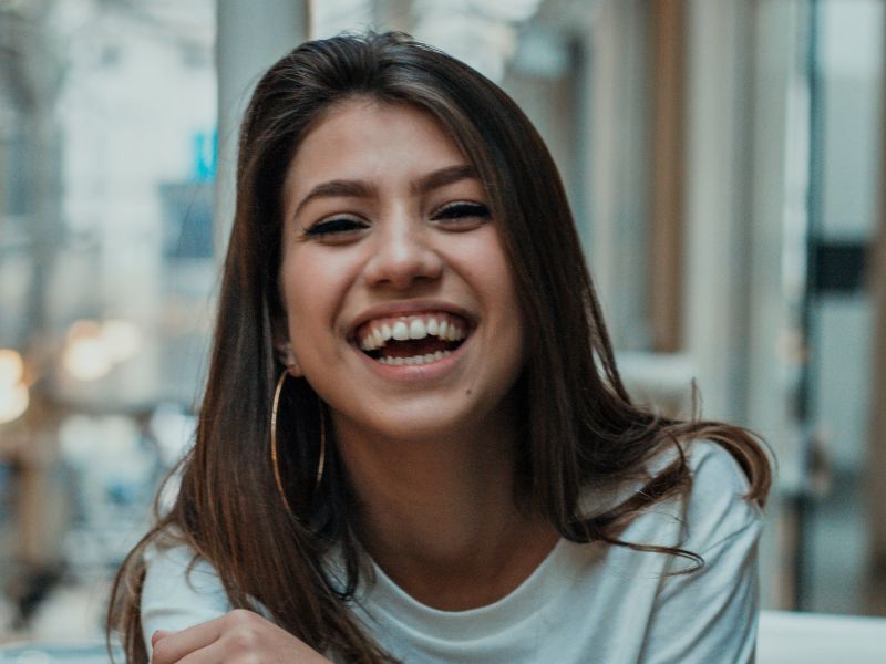 woman-long-dark-hair-smiling-at-camera-how-to-change-your-mindset-blog